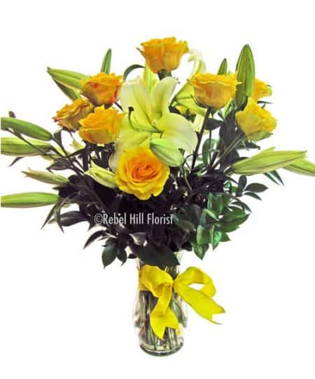 Vibrant yellow roses and lilies will brighten anyone's day!