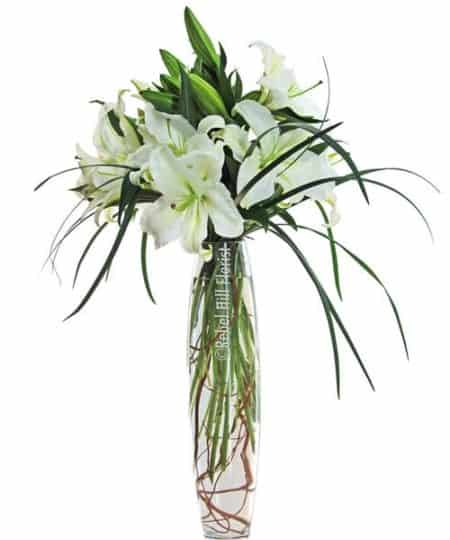 Stunning vase of Lilies. Available with white lilies, buttercream yellow lilies, or pink lilies.