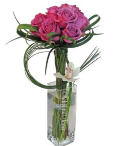 Lovely dark pink rose in a sleek vertical vase